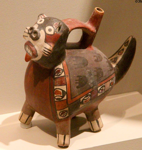 Ceramic Nazca-culture single-spout strap-handle vessel of masked feline (150-300) from south coast, Peru at Dallas Museum of Art. Dallas, TX.