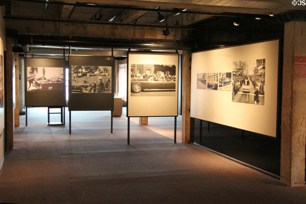 Photographic screen with stills from the Zapruder film which set the scene just before visitors approach the corner sniper's nest at The Sixth Floor Museum at Dealey Plaza. Dallas, TX.