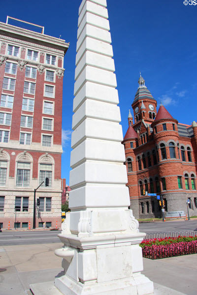Dealey Plaza Art Deco obelisk (1938-40) by Work Projects Administration flanked by County Jail Records Building & Original Court House. Dallas, TX.