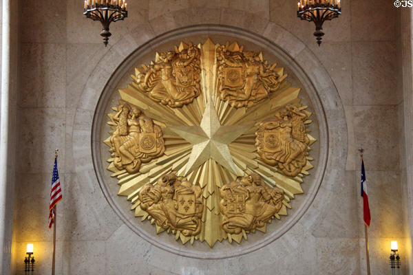 Six flags gold medallion (12 ft diameter) by Joseph E. Renier in Great Hall of State at Fair Park. Dallas, TX.