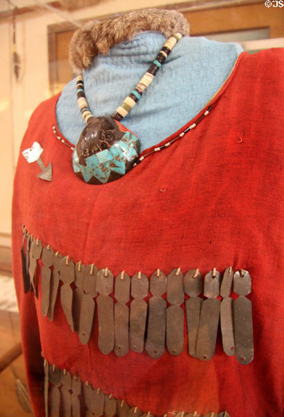 Jingle dress (c1900) to create musical effect for tribal dancing with antique turquoise necklace at Stockyards Museum. Fort Worth, TX.