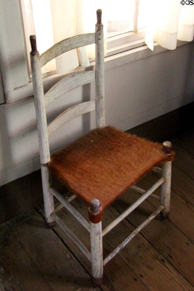Original ladder back chair with cow hide seat at John Jay French Museum. Beaumont, TX.