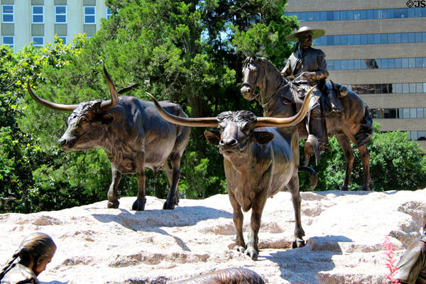 Driving longhorn cattle detail of Tejano Monument (2012) by Armando Hinojosa at Texas State Capitol. Austin, TX.