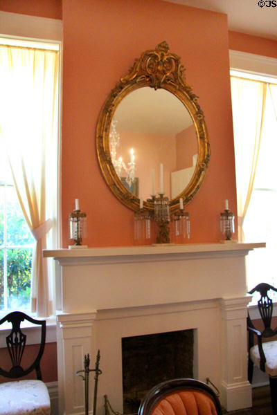 Convex mirror over parlor fireplace at Neill-Cochran House Museum. Austin, TX.