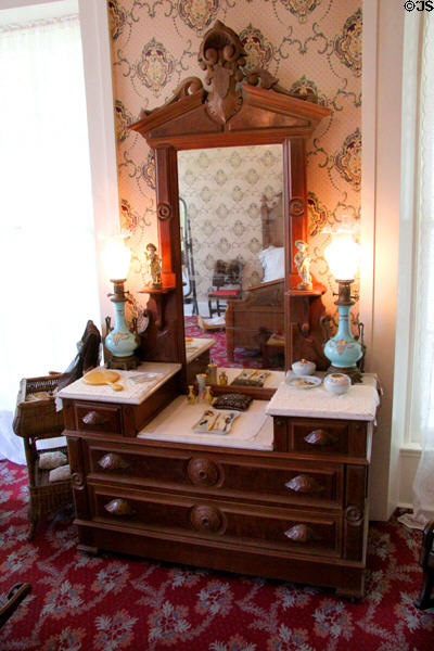 Eastlake dresser with mirror in bedroom at Neill-Cochran House Museum. Austin, TX.
