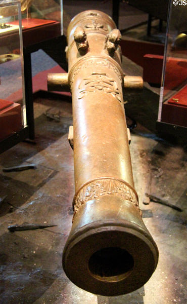 French bronze four pound cannon (c1679) excavated from La Belle Shipwreck (lent: TX Historical Commission) at Bullock Texas State History Museum. Austin, TX.