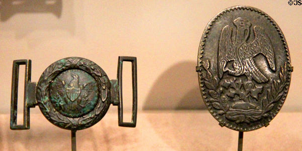 U.S. militia officer's belt plate (c1835) & Mexican staff officer's belt plate (c1846) (lent: Texas Museum of Military History) at Bullock Texas State History Museum. Austin, TX.