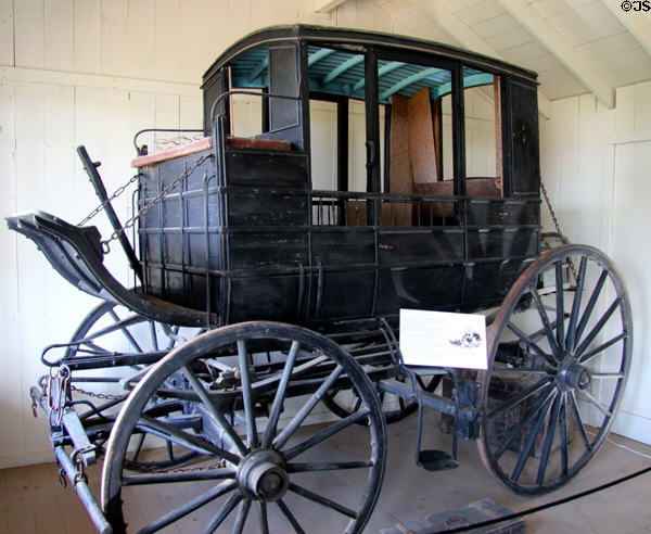 Texas Mud Wagon (1870s) a stage coach good for muddy roads in Wagon Shop at Pioneer Farms. Austin, TX.