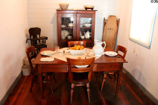 Wood dining table, chairs & cupboard in Jahn House at Conservation Plaza. New Braunfels, TX.