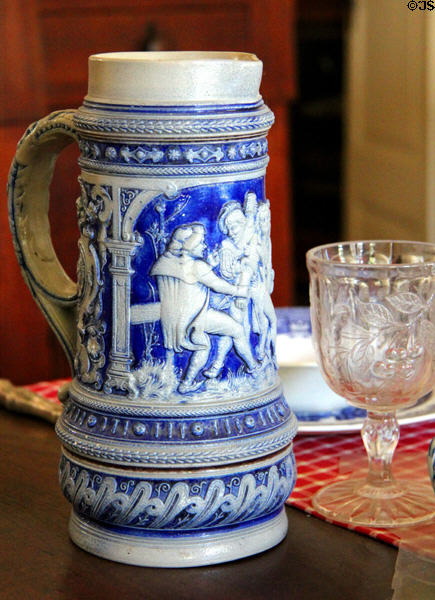 Cobalt blue beer stein with design in relief in Baetge House at Conservation Plaza. New Braunfels, TX.