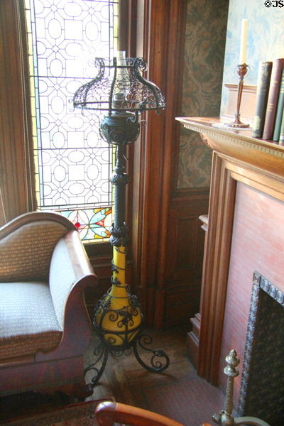 Wrought iron floor oil lamp (19thC) in west hall sitting area at Park-McCullough Historic Estate. North Bennington, VT.