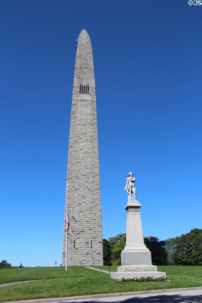 Revolutionary War hero Col. Seth Warner statue (1910) before Bennington Monument. Bennington, VT.