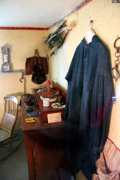 Shed bedroom with farm cloak worn by President when photographed in Coolidge Homestead at President Calvin Coolidge State Historic Park. Plymouth Notch, VT.