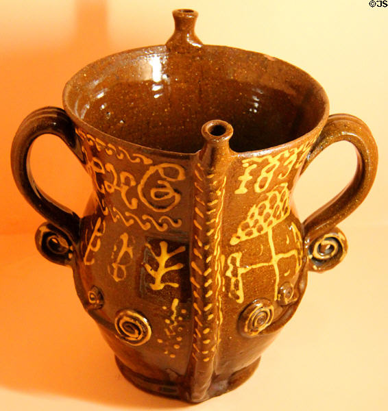 Redware posset pot (1830) to sip liquid below soggy bread upper posset layer at Shelburne Museum. Shelburne, VT.