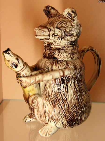 Earthenware jug in form of muzzled bear (late 18thC) from Staffordshire England at Shelburne Museum. Shelburne, VT.
