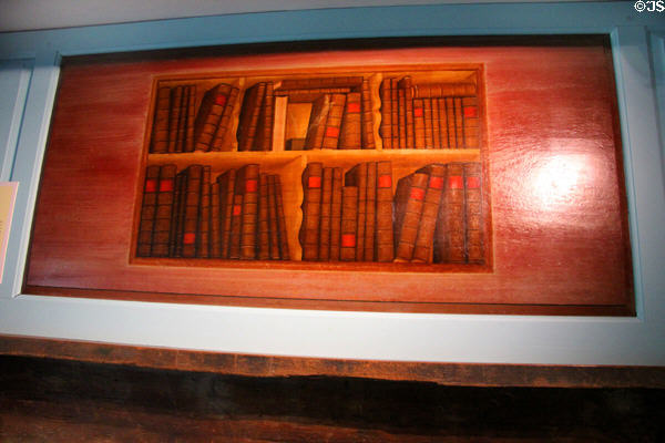 Overmantle with painted trompe l'oeil bookshelf (c1775) by Winthrop Chandler at Shelburne Museum. Shelburne, VT.
