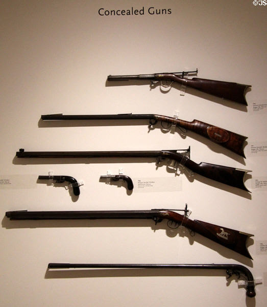 Examples of concealed guns with hammer under gun to put under seats of buckboards in Vermont-made firearms collection in Beach Gallery at Shelburne Museum. Shelburne, VT.