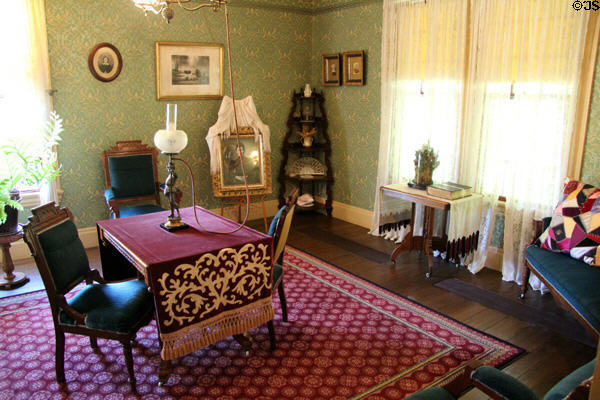 Farm house parlor with table gas lamp at Billings Farm & Museum. Woodstock, VT.