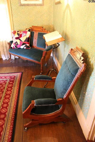 Stationary rocking chair in farm house parlor at Billings Farm & Museum. Woodstock, VT.
