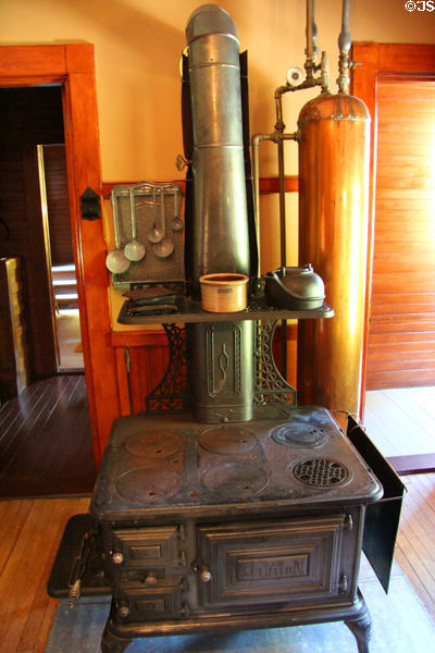 Clarion cast iron coal range (c1913) & copper water heater in kitchen of farm house at Billings Farm & Museum. Woodstock, VT.