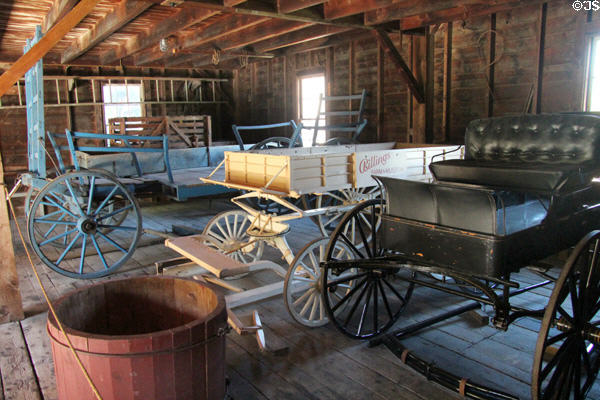 Hay wagon (c1885-1915), express wagon with springs (c1880), & democrat wagon or buggy (c1890) at Billings Farm & Museum. Woodstock, VT.