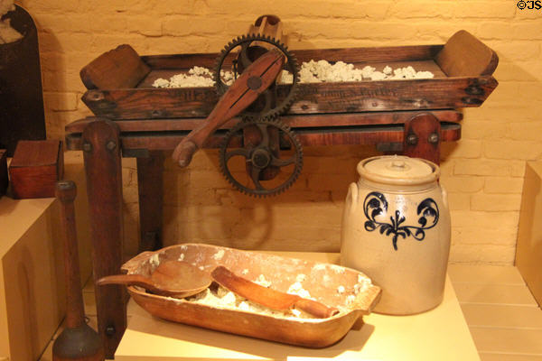 Roller butter worker to remove remaining milk (late 1800s) over earlier wooden bowl & paddle plus stoneware butter crock at Billings Farm & Museum. Woodstock, VT.