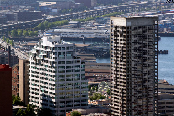 Highrise apartments against Seattle's waterfront peers from Space Needle. Seattle, WA.