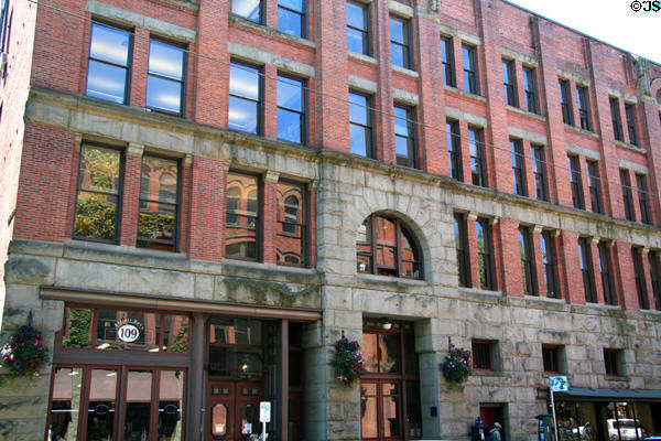 Stone & brick heritage building (109 S. Main St.) near Occidental Park. Seattle, WA.