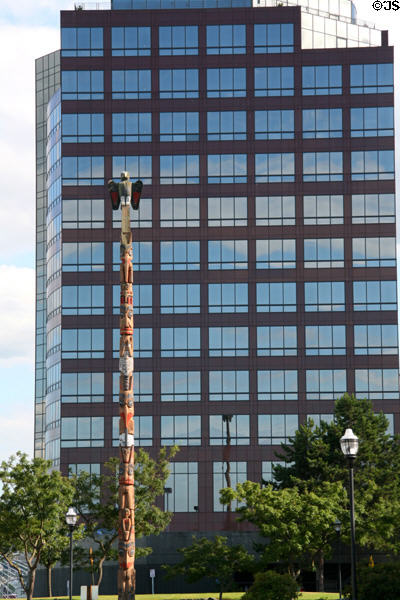 Totem Pole against Frank Russell Building. Tacoma, WA.
