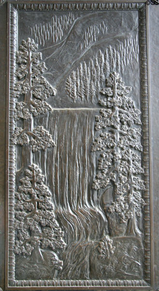Panel of forest & waterfall on bronze doors (1928) of Washington State Capitol. Olympia, WA.