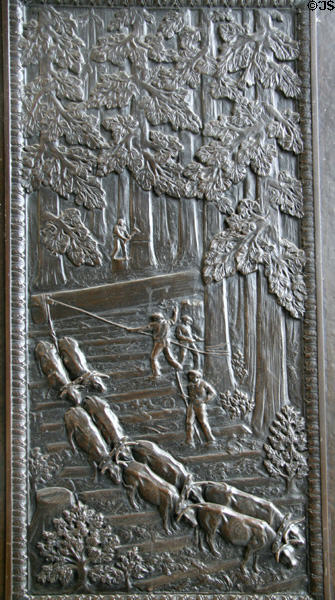 Panel of oxen pulling trees out of forest on bronze doors (1928) of Washington State Capitol. Olympia, WA.