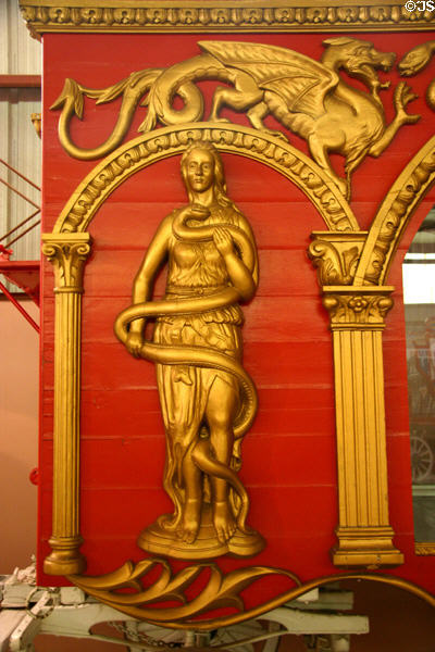 Carving of snake charmer & dragon on Ringling Bros. snake den circus wagon at Circus World Museum. Baraboo, WI.