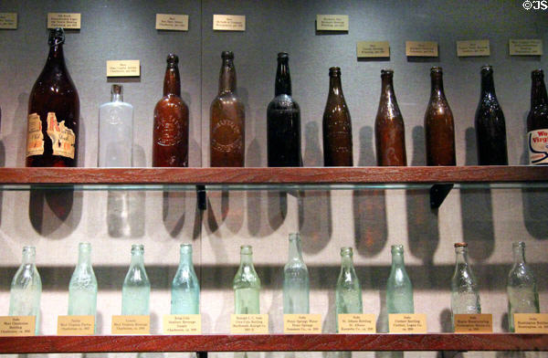 Collection of early 20thC WV-made glass bottles at West Virginia State Museum. Charleston, WV.