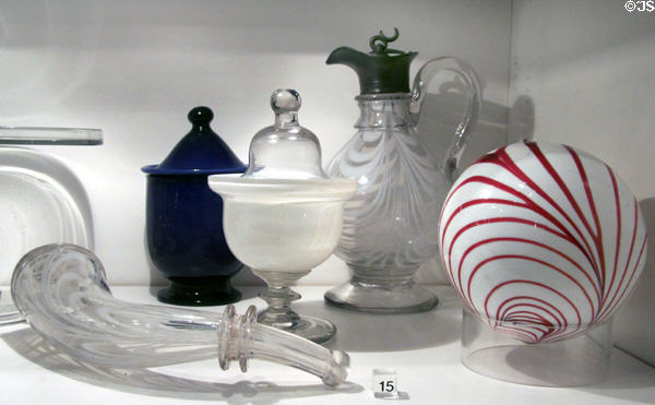 Whimsy powder horn (1860-70), covered sugar dishes (mid-19thC), Witch Ball (1845-60) & syrup decanter (1850-70) from the Ohio River Valley in glass gallery at Huntington Museum of Art. Huntington, WV.