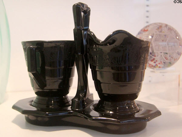 Black pressed glass creamer & sugar on stand (c1925-1929) by Paden City Glass Co., Paden City, WV at Huntington Museum of Art. Huntington, WV.