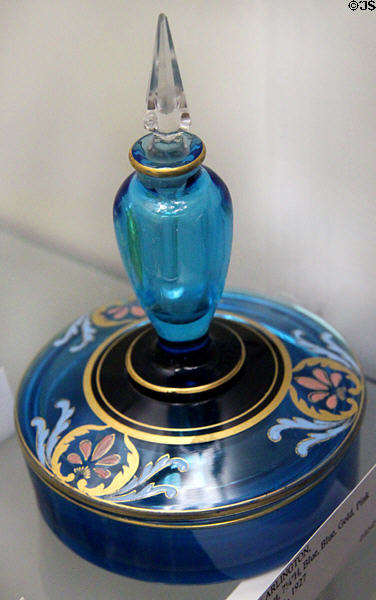Arlington stoppered perfume bottle in blue with blue, pink, black & gold trim (1927) at Fostoria Glass Museum. Moundsville, WV.