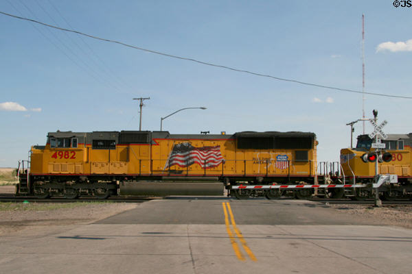 Union Pacific diesel locomotive at level crossing. Cheyenne, WY.