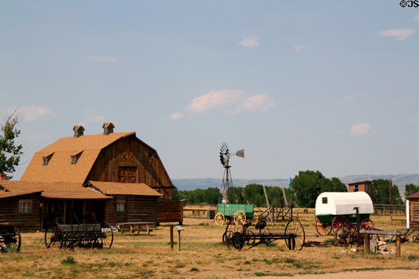 Antique farm implements & barn at Wyoming Territorial Prison. Laramie, WY.