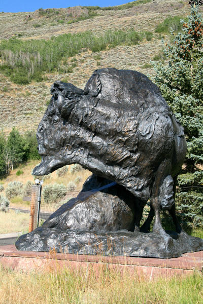 Bison in Change of Seasons sculpture (1994) by T.D. Kelsey outside National Wildlife Museum of Art. Jackson, WY.