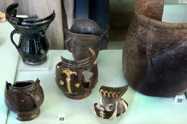 Medieval Cistercian pottery cups & pots excavated from Liverpool at Museum of Liverpool. Liverpool, England.