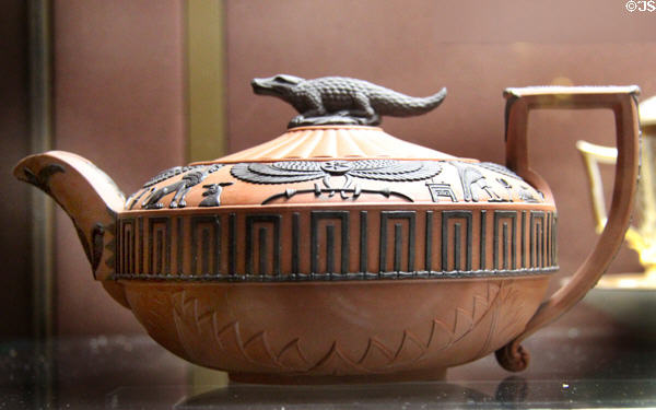 Stoneware (rosso antico) Egyptian revival teapot (1810-20) with applied decorative elements & crocodile on lid by Wedgwood at National Museum of Wales. Cardiff, Wales.