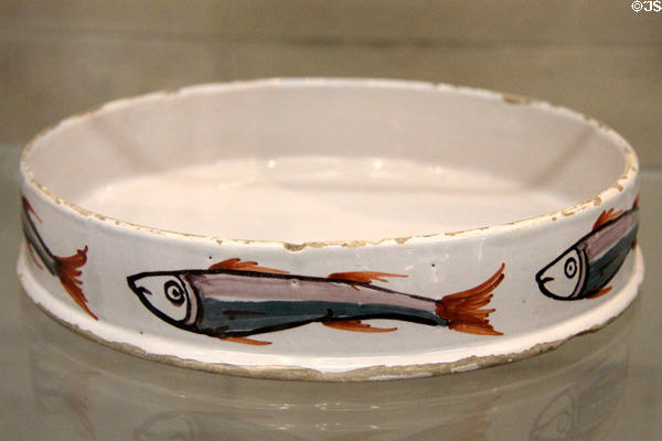 Char dish (c1760) with Char painted around the sides & used for serving this cold water fish, similar to salmon or trout, tin-glazed earthenware, made in Liverpool at National Museum of Wales. Cardiff, Wales.