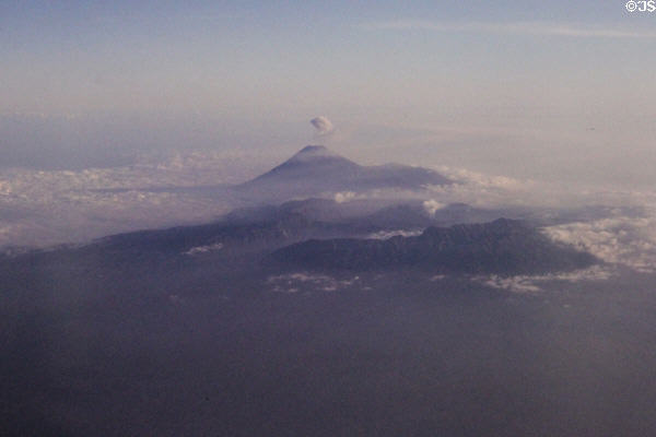 Volcano on Java gives off plume of smoke. Indonesia.