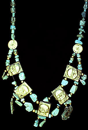 Lambayeque gold & turquoise necklace with faces in Gold Museum in Lima. Peru.