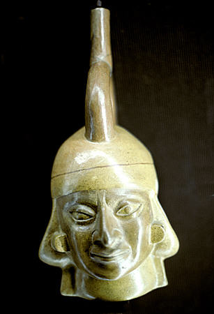 Moche bottle with face (100-800) in Gold Museum in Lima. Peru.
