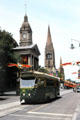 Streetcar in front of Melbourne Town Hall with St Paul's Cathedral beyond. Melbourne, Australia.