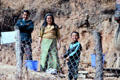 A Paro family beside fence. Bhutan.