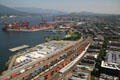 Vancouver container port, rail yards & views east to hills of Burnaby. Vancouver, BC.