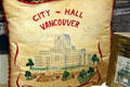 Pillow embroidered with Vancouver City Hall at Vancouver Museum. Vancouver, BC.