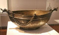 Engraved brass beggar's bowl from Iran at Aga Khan Museum. Toronto, ON.